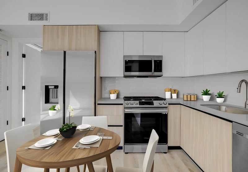 Kitchen and dining nook with stainless appliances at The Felix on Fairfax