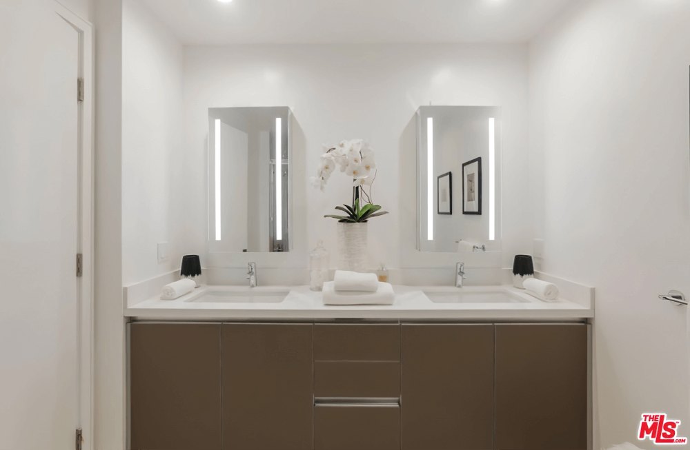 Double-vanity primary bathroom at Olympic Towers